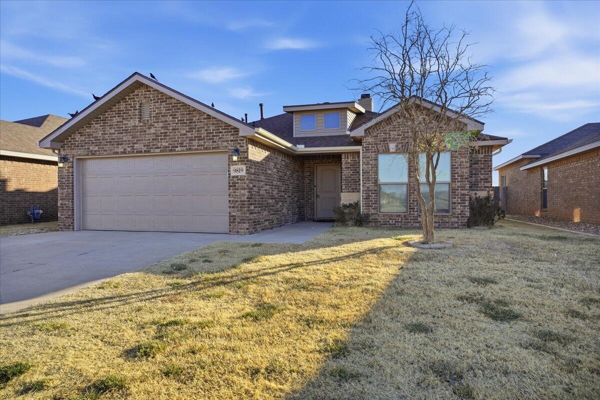 9819 Virginia Avenue Lubbock, TX 79424 - Photo 29 of 29 a front view of a house with a yard