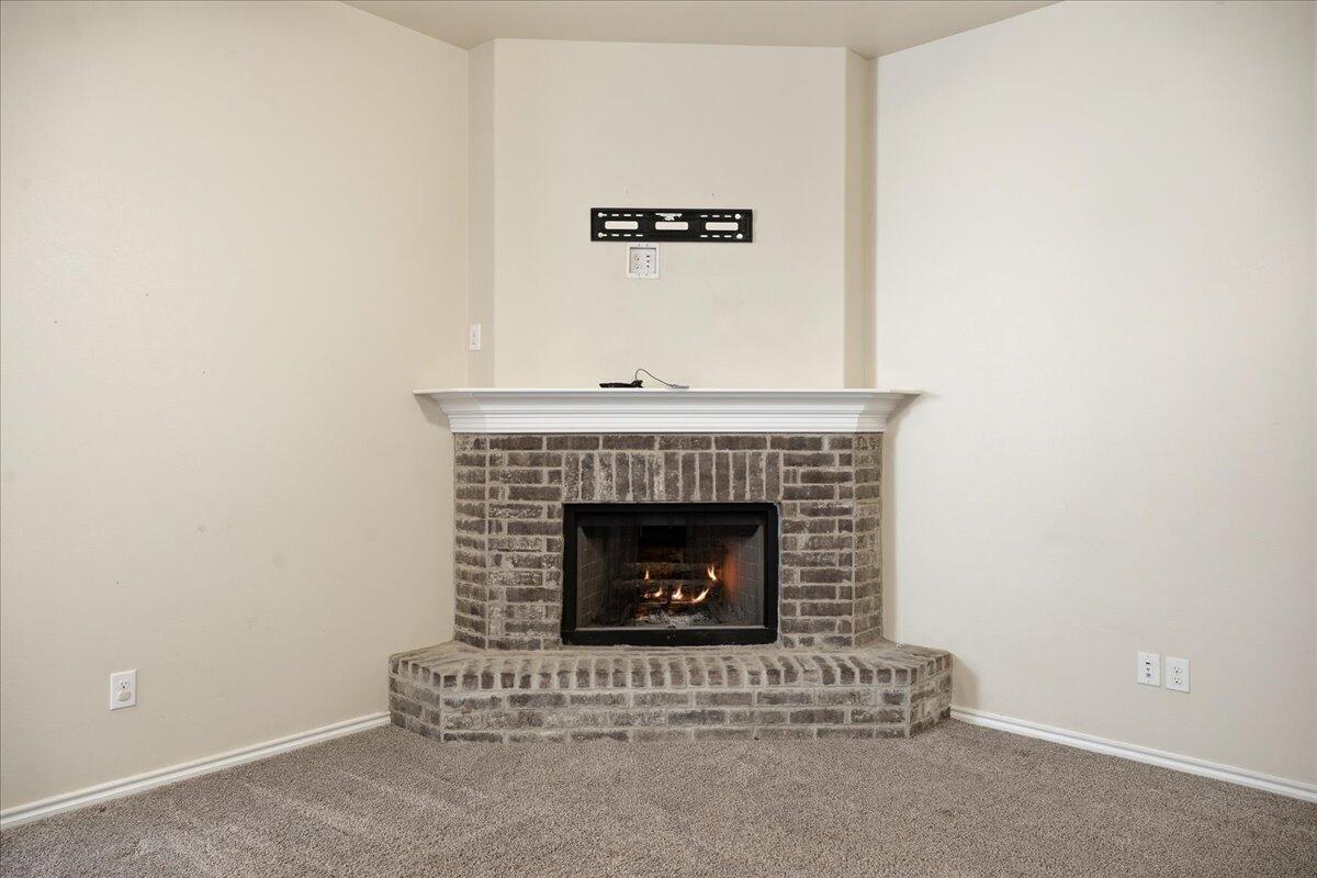 9819 Virginia Avenue Lubbock, TX 79424 - Photo 5 of 29 a room with a fireplace