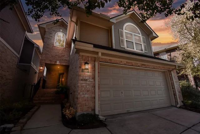 a front view of a house with a garage