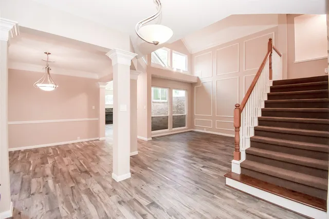 a view of entryway with wooden floor