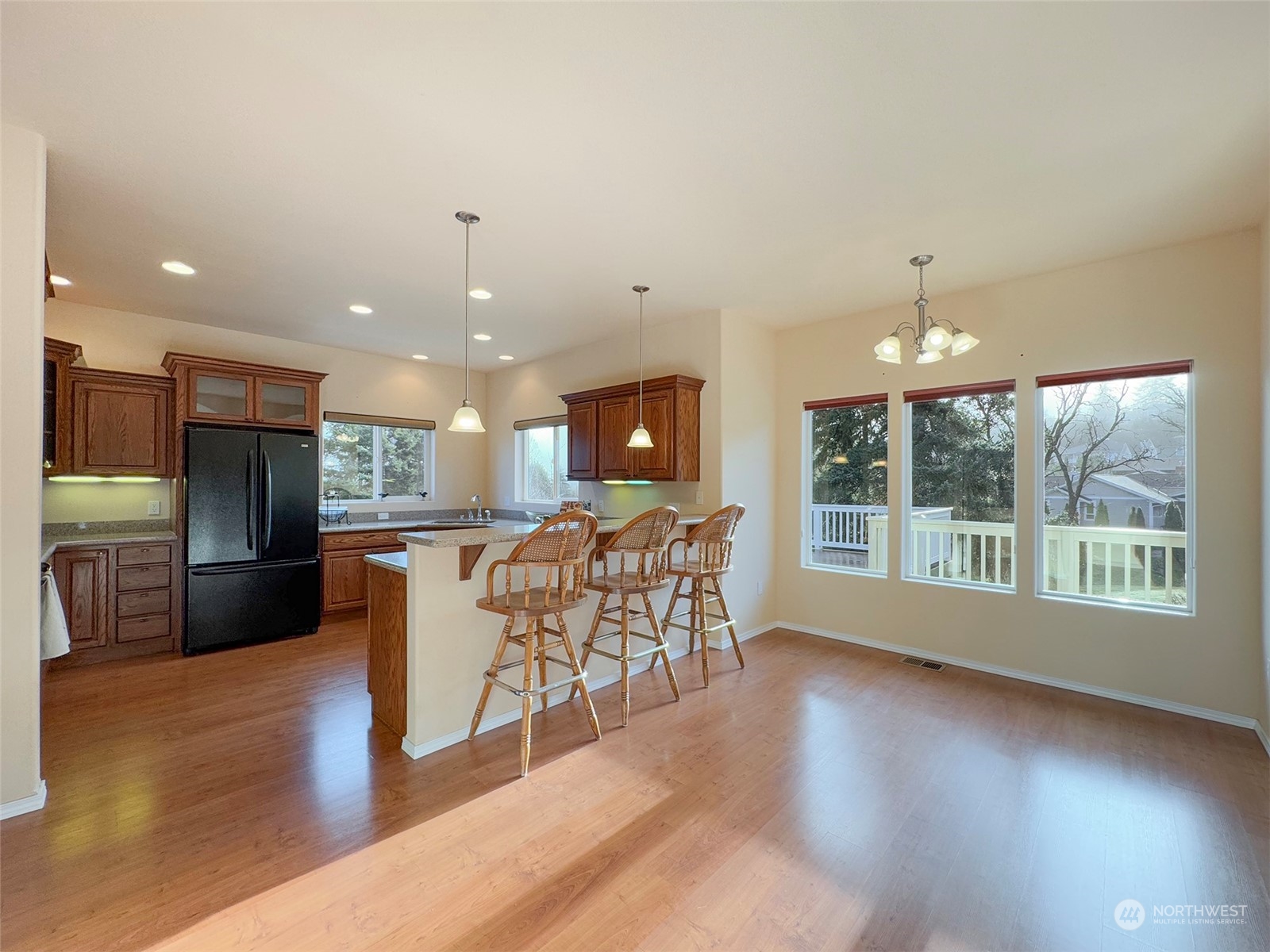 201 Brigadoon Boulevard Sequim, WA 98382 - Photo 11 of 35 an open kitchen with kitchen island and stainless steel appliances