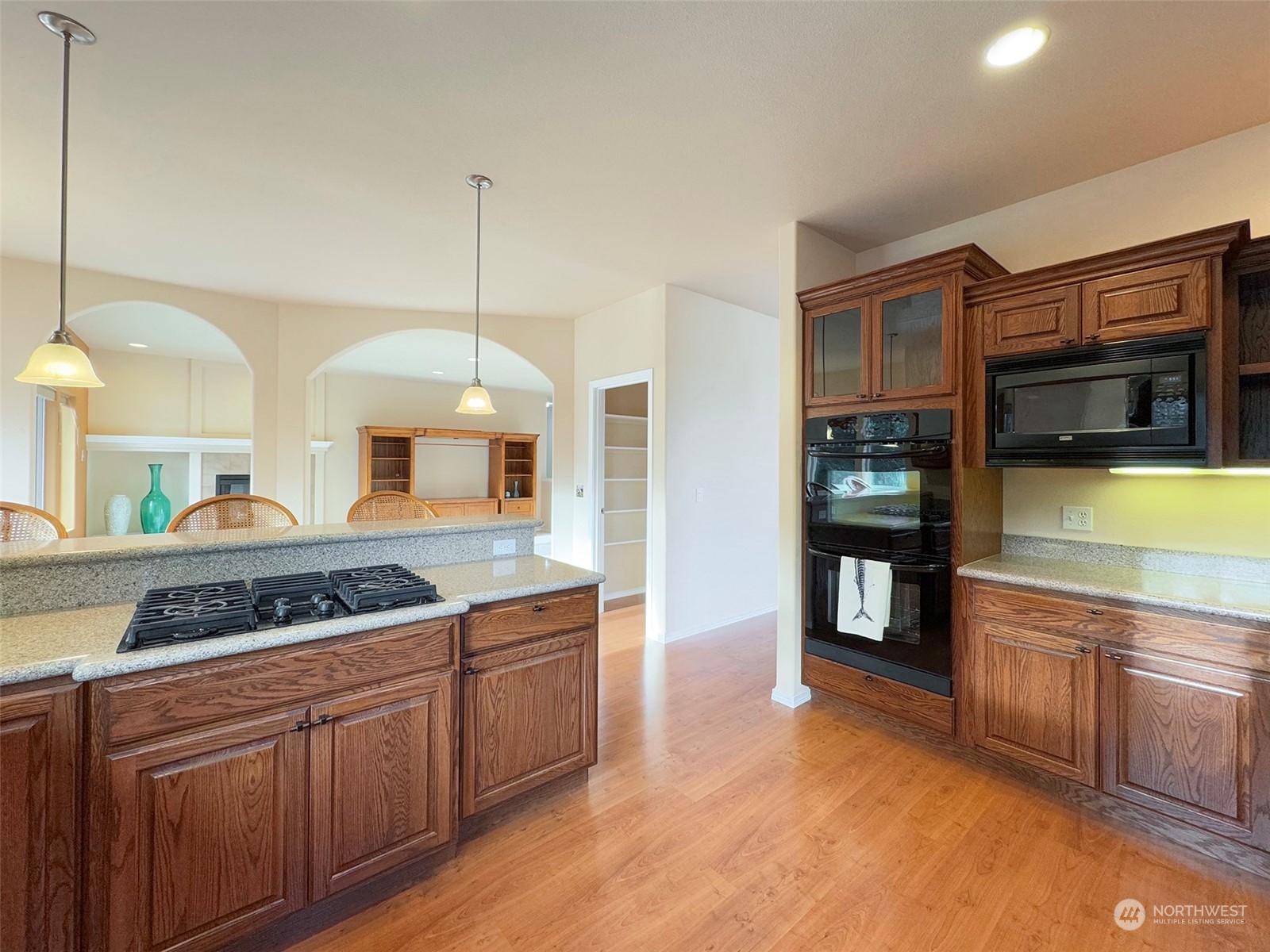 201 Brigadoon Boulevard Sequim, WA 98382 - Photo 13 of 35 a kitchen with stainless steel appliances granite countertop a sink and cabinets