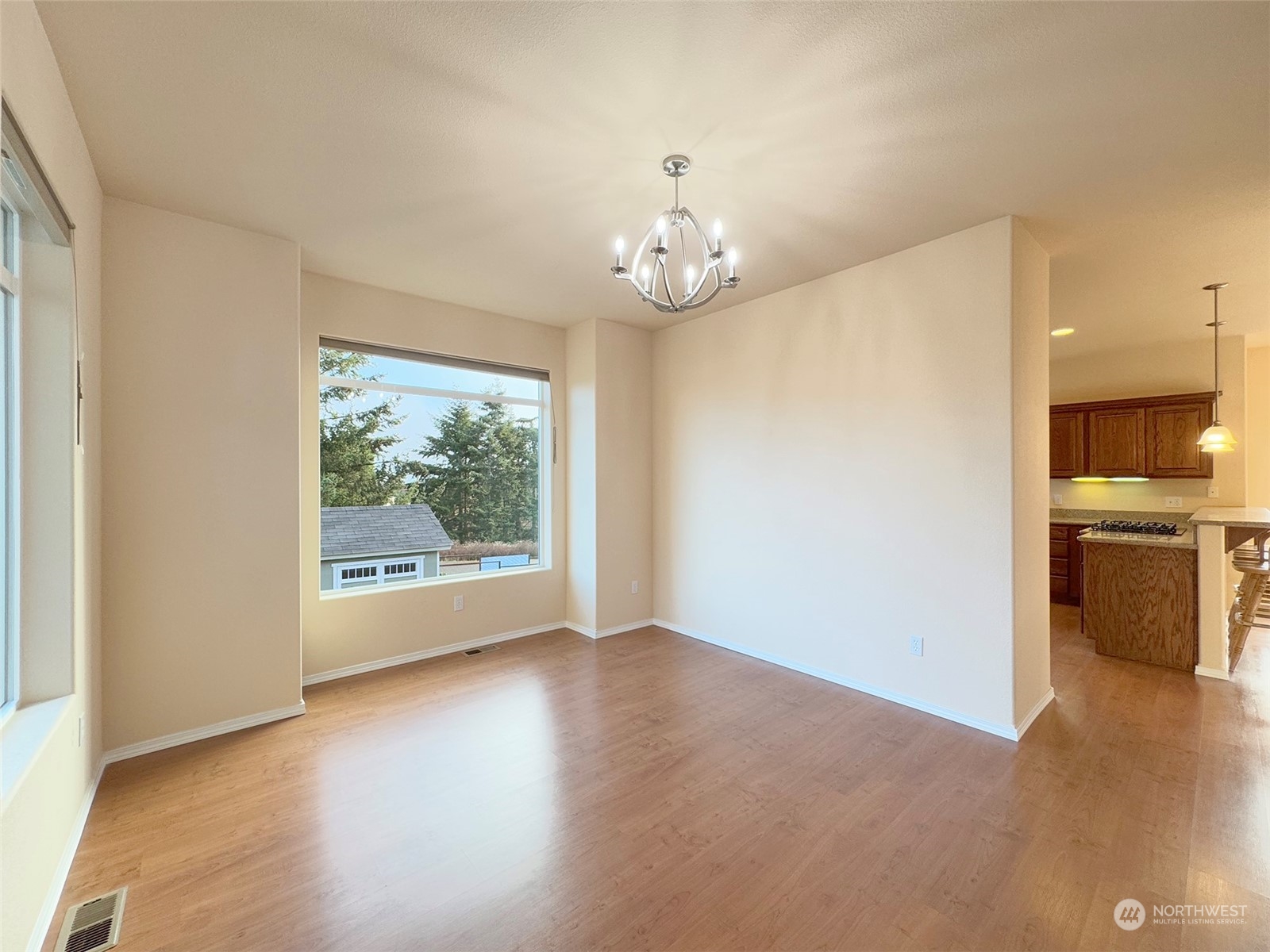 201 Brigadoon Boulevard Sequim, WA 98382 - Photo 16 of 35 wooden floor in an empty room with a window