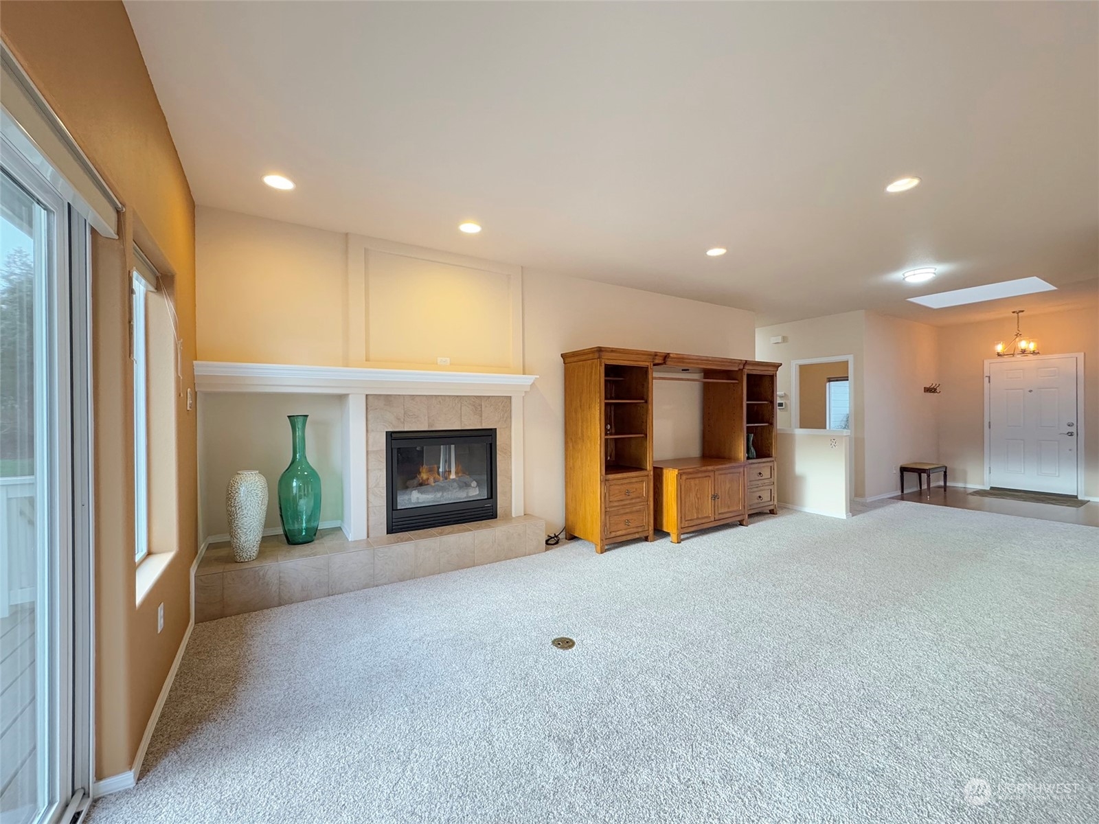 201 Brigadoon Boulevard Sequim, WA 98382 - Photo 17 of 35 a view of an empty room with fireplace and a window
