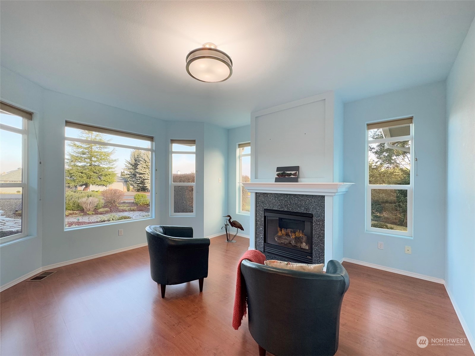 201 Brigadoon Boulevard Sequim, WA 98382 - Photo 19 of 35 a living room with furniture and a fireplace