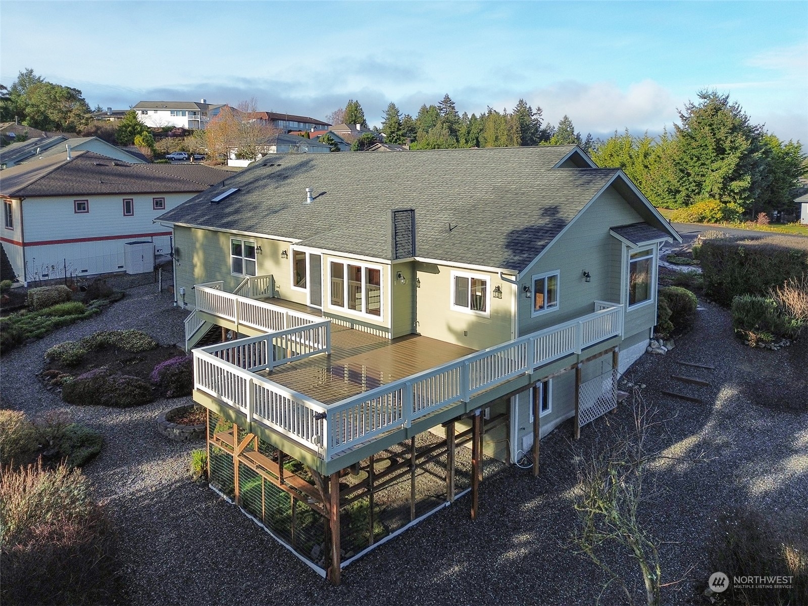 201 Brigadoon Boulevard Sequim, WA 98382 - Photo 28 of 35 a aerial view of a house with roof deck front of house