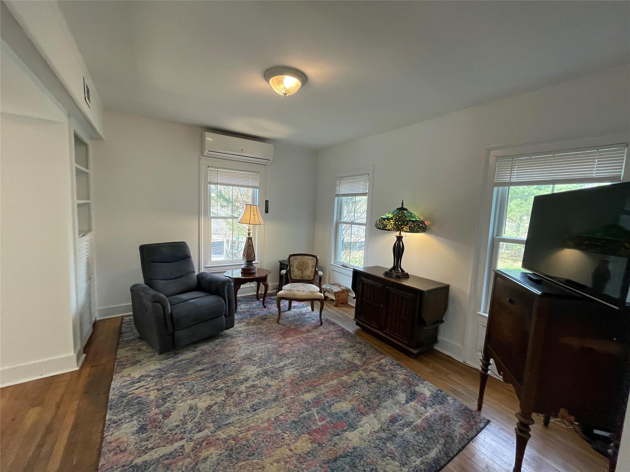 190 South Country Road Remsenburg, NY 11960 - Photo 11 of 20 a living room with furniture and a flat screen tv