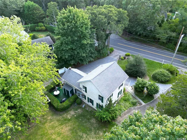 a view of a house with a yard and plants