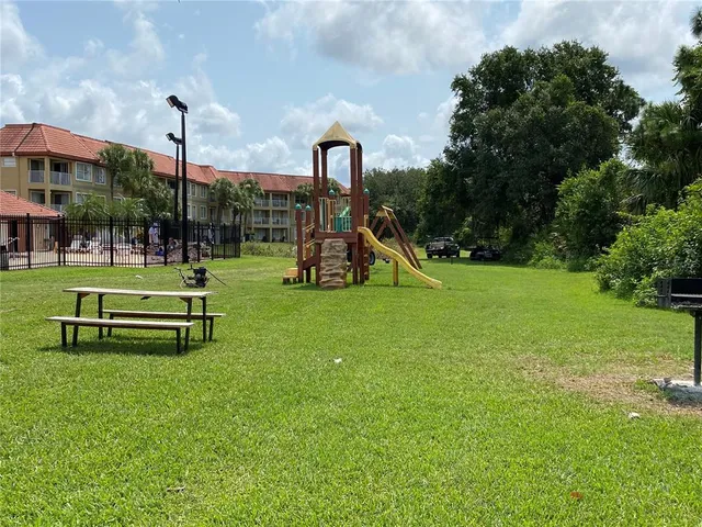 a view of a park with swings and slides