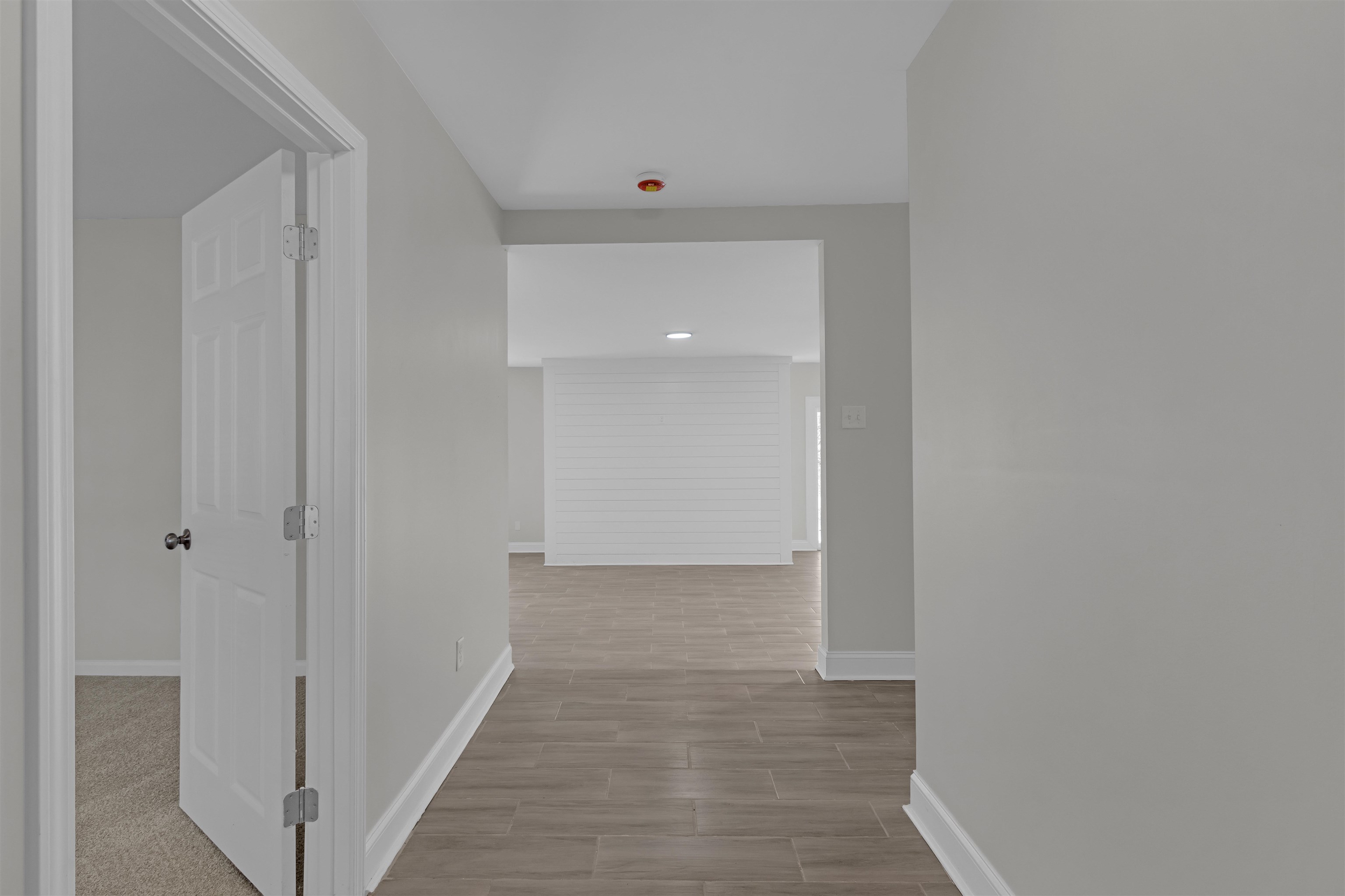 1296 Monasco Road Millington, TN 38053 - Photo 5 of 32 a view of a hallway with wooden floor