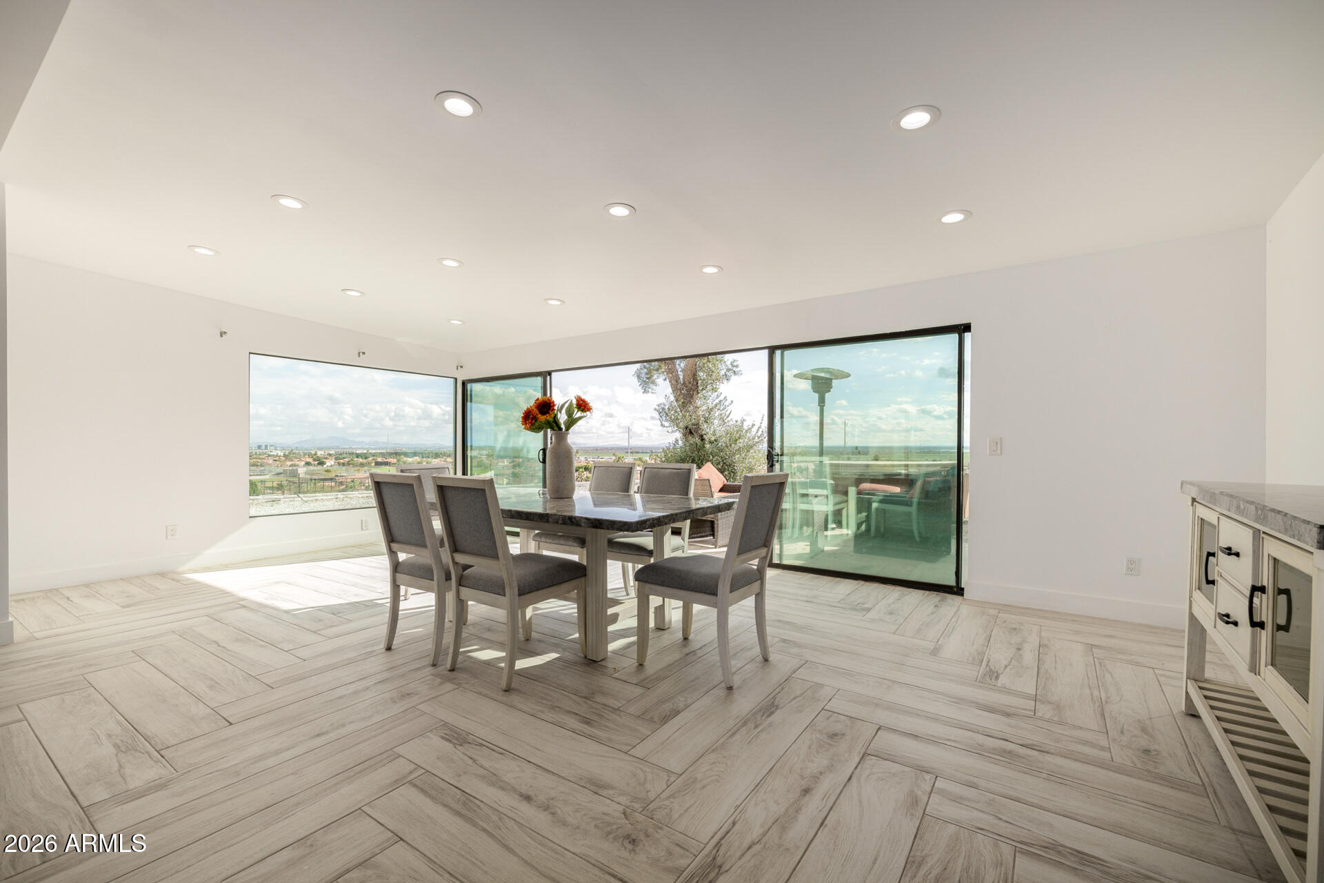 2809 East Frye Road Phoenix, AZ 85048 - Photo 20 of 47 a view of a dining room with furniture and wooden floor