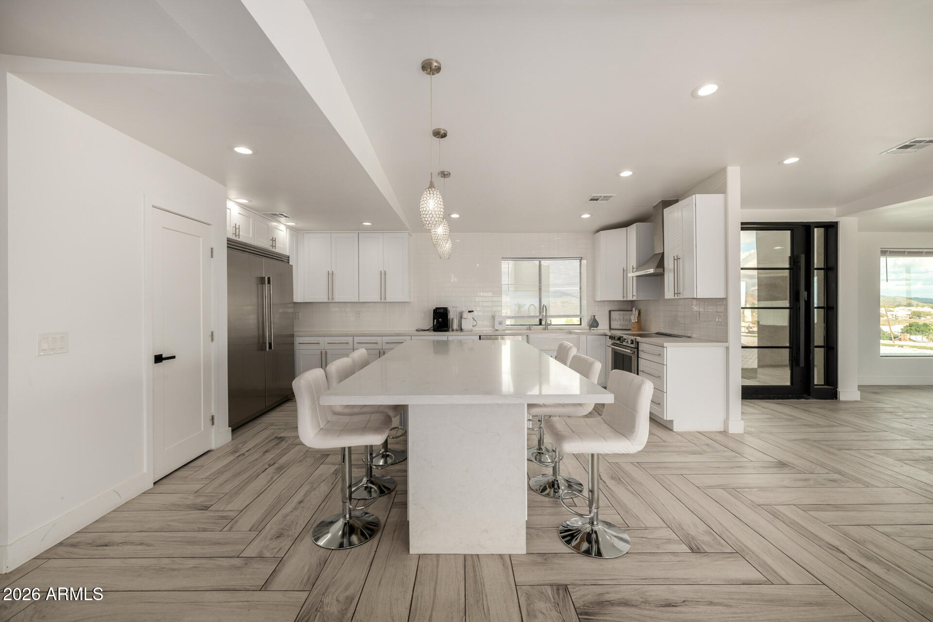 2809 East Frye Road Phoenix, AZ 85048 - Photo 21 of 47 a large white kitchen with lots of counter space and stainless steel appliances