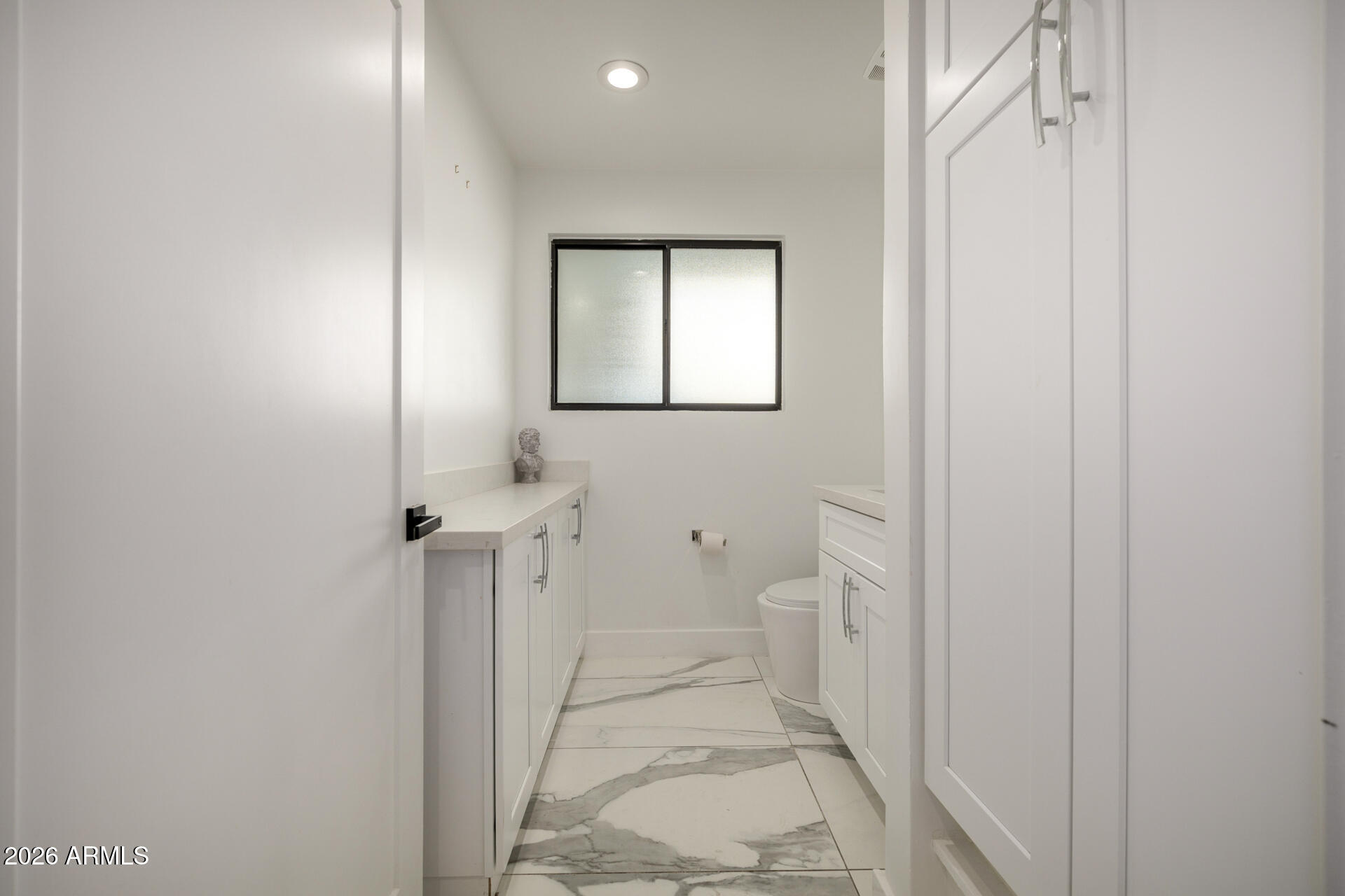 2809 East Frye Road Phoenix, AZ 85048 - Photo 25 of 47 a bathroom with a sink and a toilet