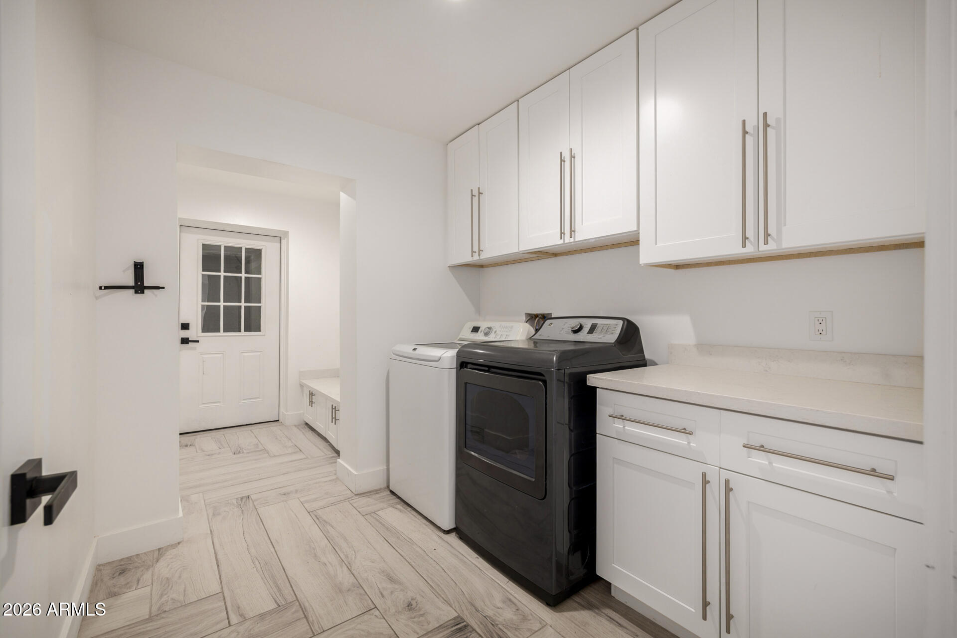 2809 East Frye Road Phoenix, AZ 85048 - Photo 45 of 47 a utility room with cabinets washer and dryer