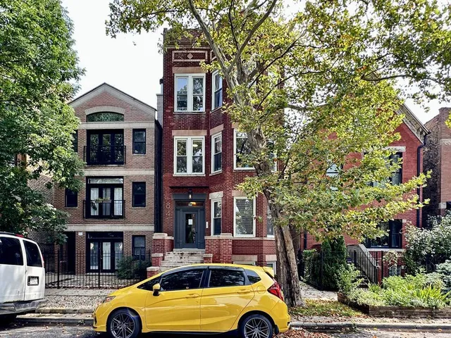 a front view of a house with parking space