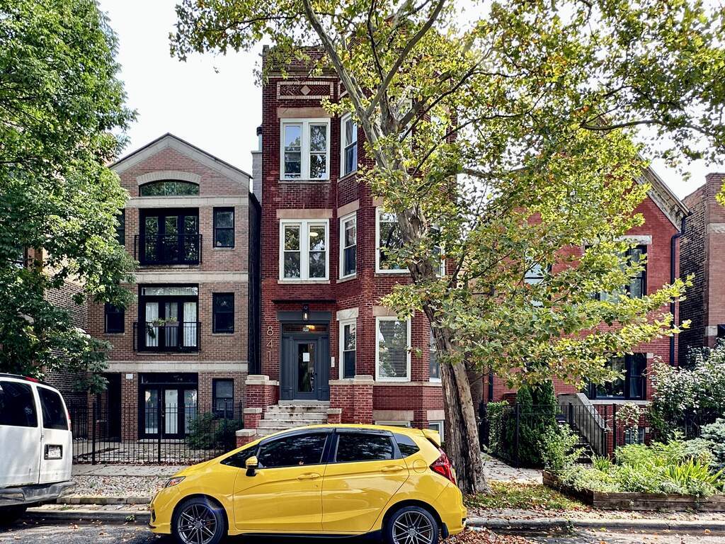 841 North Mozart Street, Unit 3F Chicago, IL 60622 - Photo 1 of 20 a front view of a house with parking space