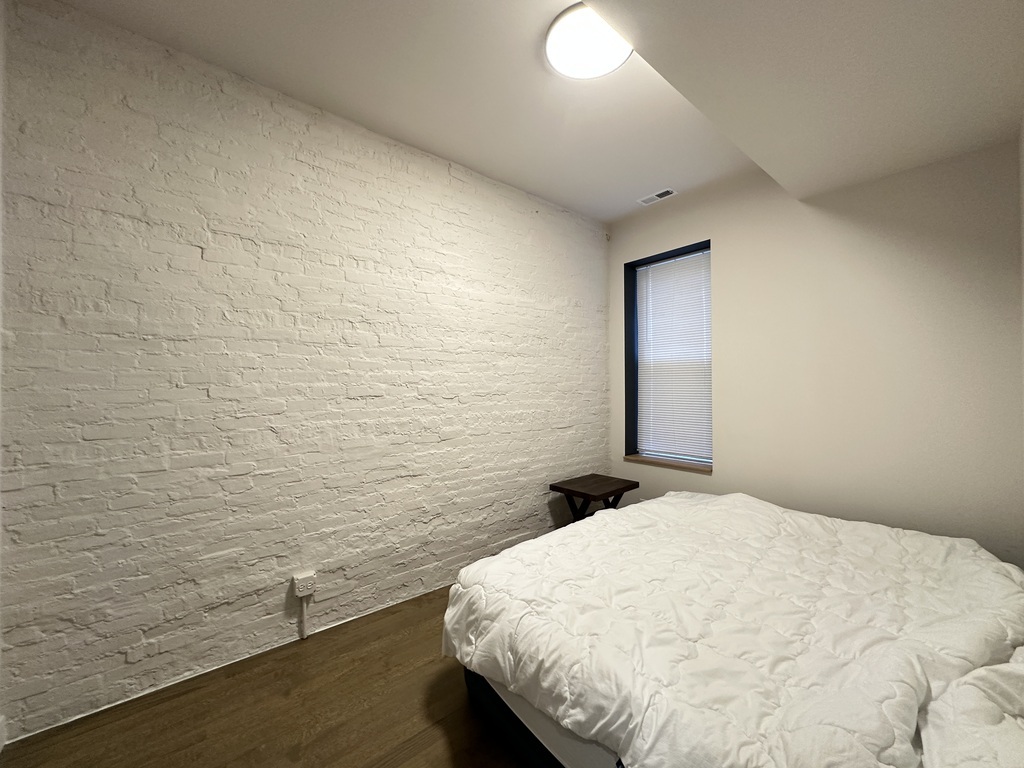 841 North Mozart Street, Unit 3F Chicago, IL 60622 - Photo 16 of 20 a bathroom with a sink and a mirror