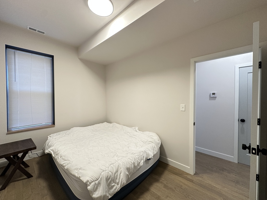 841 North Mozart Street, Unit 3F Chicago, IL 60622 - Photo 17 of 20 a bedroom with a bed and a window