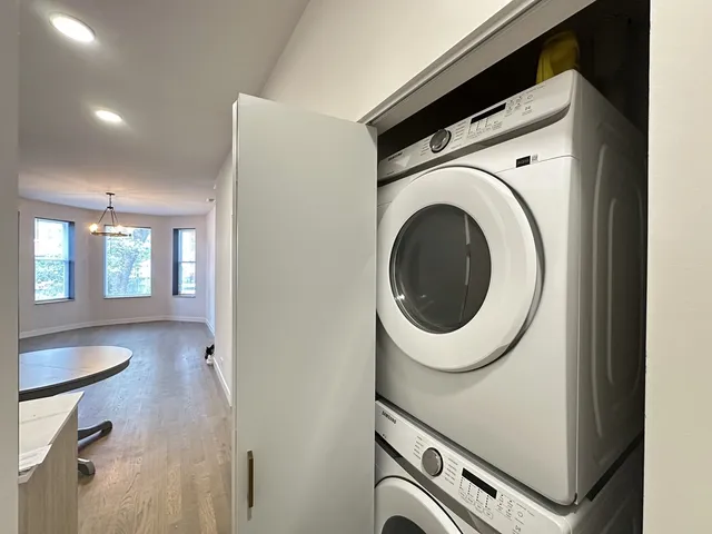 a view of a kitchen with washer and dryer