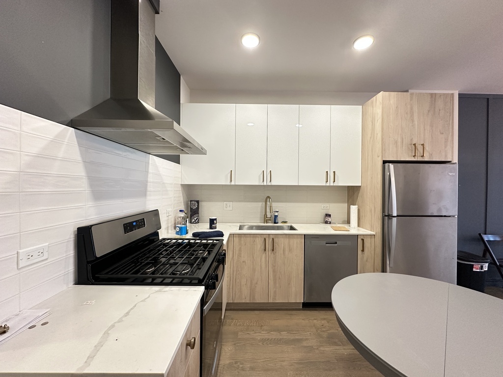 841 North Mozart Street, Unit 3F Chicago, IL 60622 - Photo 4 of 20 a kitchen with a stove a refrigerator and a sink