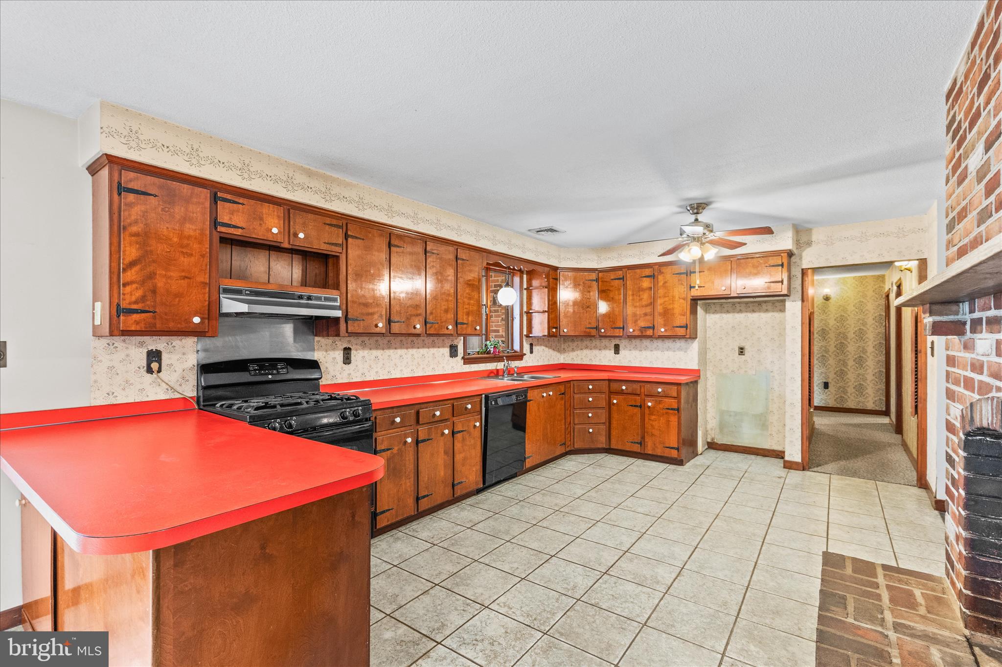 521 Windy Hill Road New Freedom, PA 17349 - Photo 21 of 66 a kitchen with stainless steel appliances a stove sink and cabinets