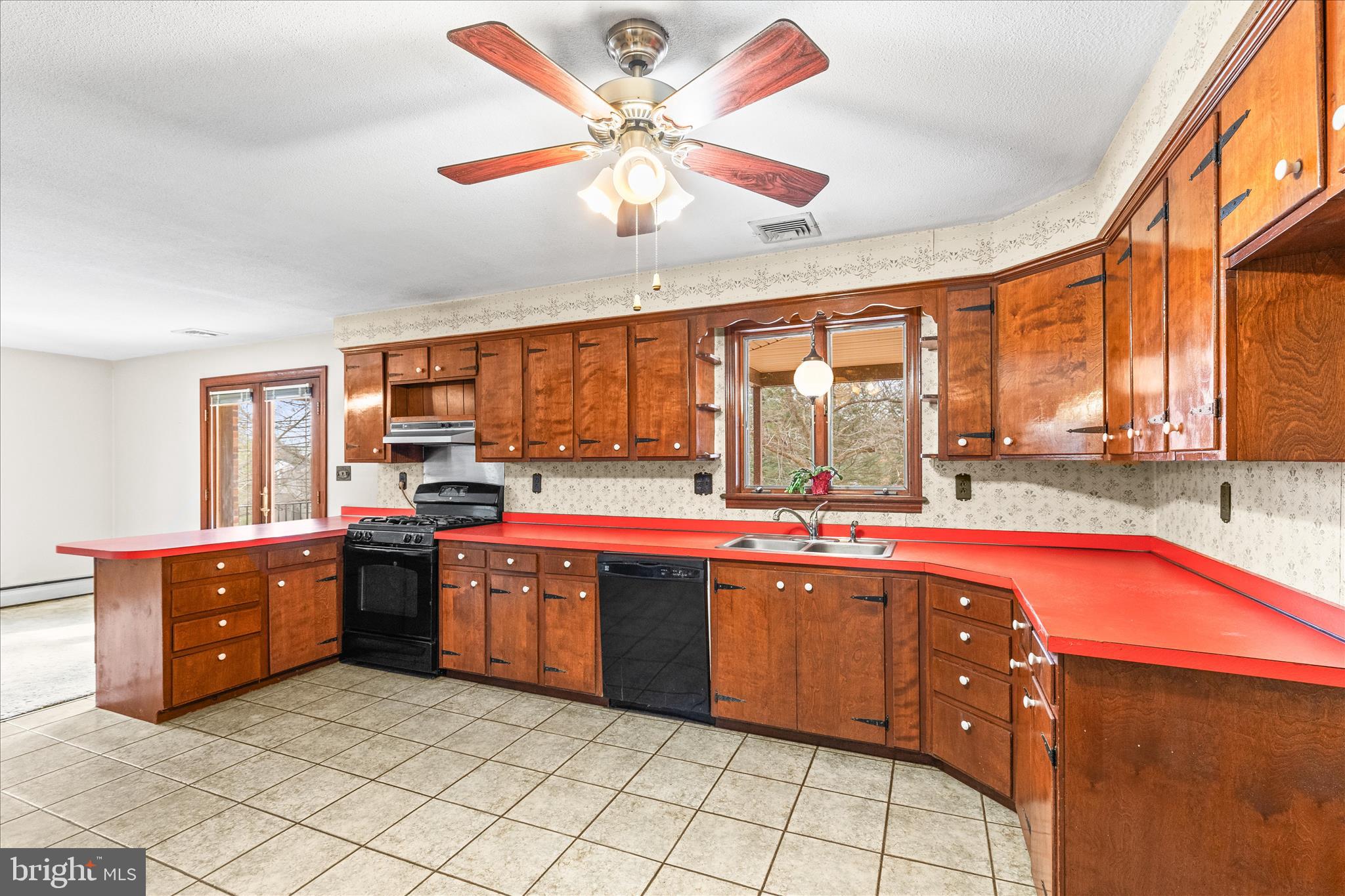 521 Windy Hill Road New Freedom, PA 17349 - Photo 22 of 66 a large kitchen with stainless steel appliances granite countertop a sink and cabinets