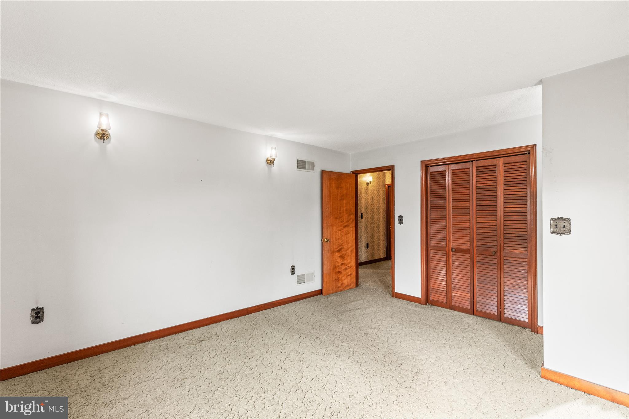 521 Windy Hill Road New Freedom, PA 17349 - Photo 27 of 66 an empty room with closet and sliding door