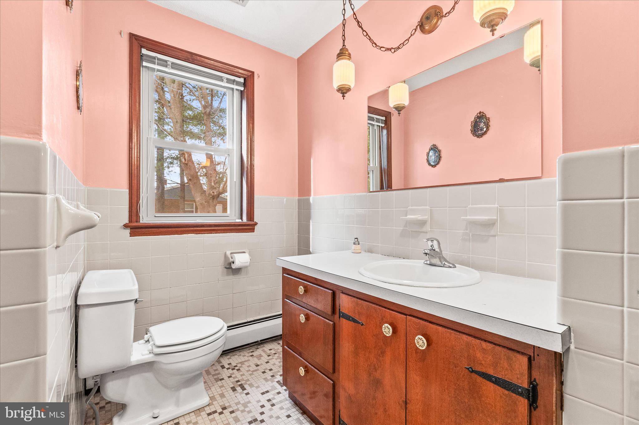 521 Windy Hill Road New Freedom, PA 17349 - Photo 36 of 66 a bathroom with a sink a toilet and a mirror