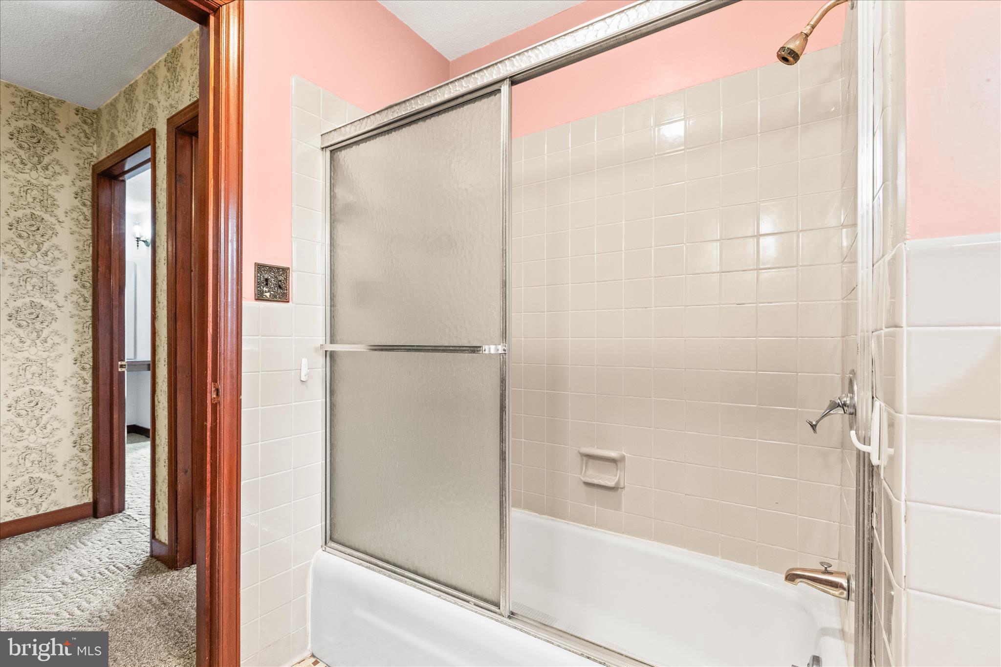 521 Windy Hill Road New Freedom, PA 17349 - Photo 37 of 66 a bathroom with a glass shower door