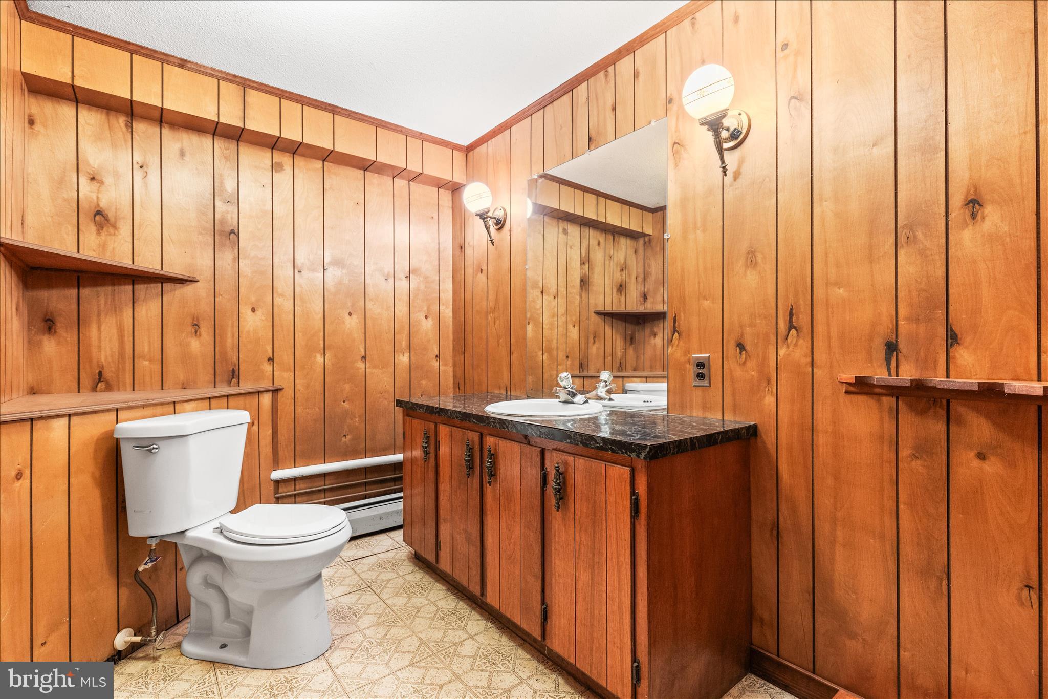521 Windy Hill Road New Freedom, PA 17349 - Photo 47 of 66 a bathroom with a toilet a sink and a shower curtain