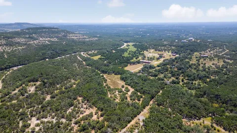 an aerial view of residential house and green space