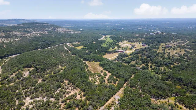 an aerial view of residential house and green space