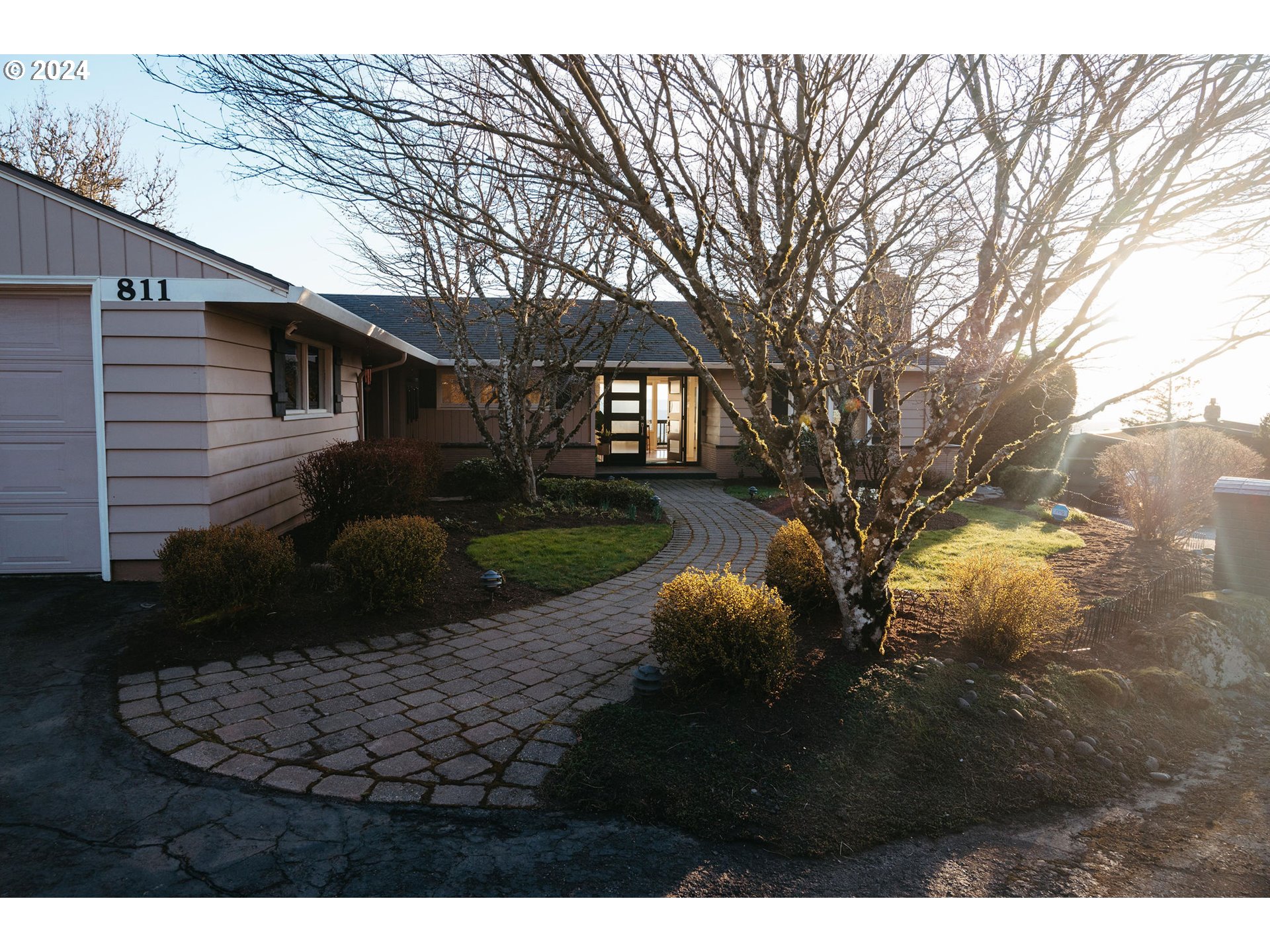 811 Northwest Skyline Crest Road Portland, OR 97229 - Photo 1 of 45 a view of a house with backyard and trees