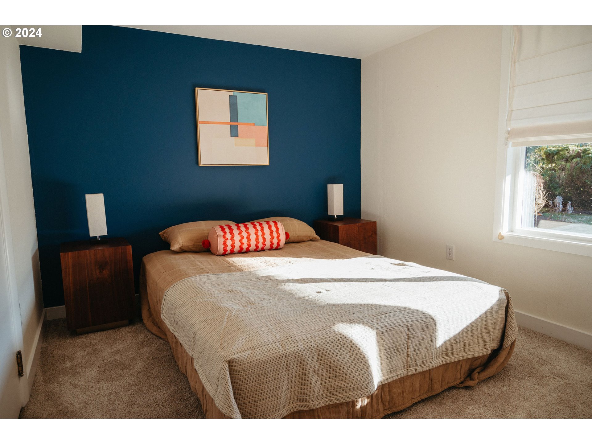 811 Northwest Skyline Crest Road Portland, OR 97229 - Photo 24 of 45 a bedroom with a bed and a night stand