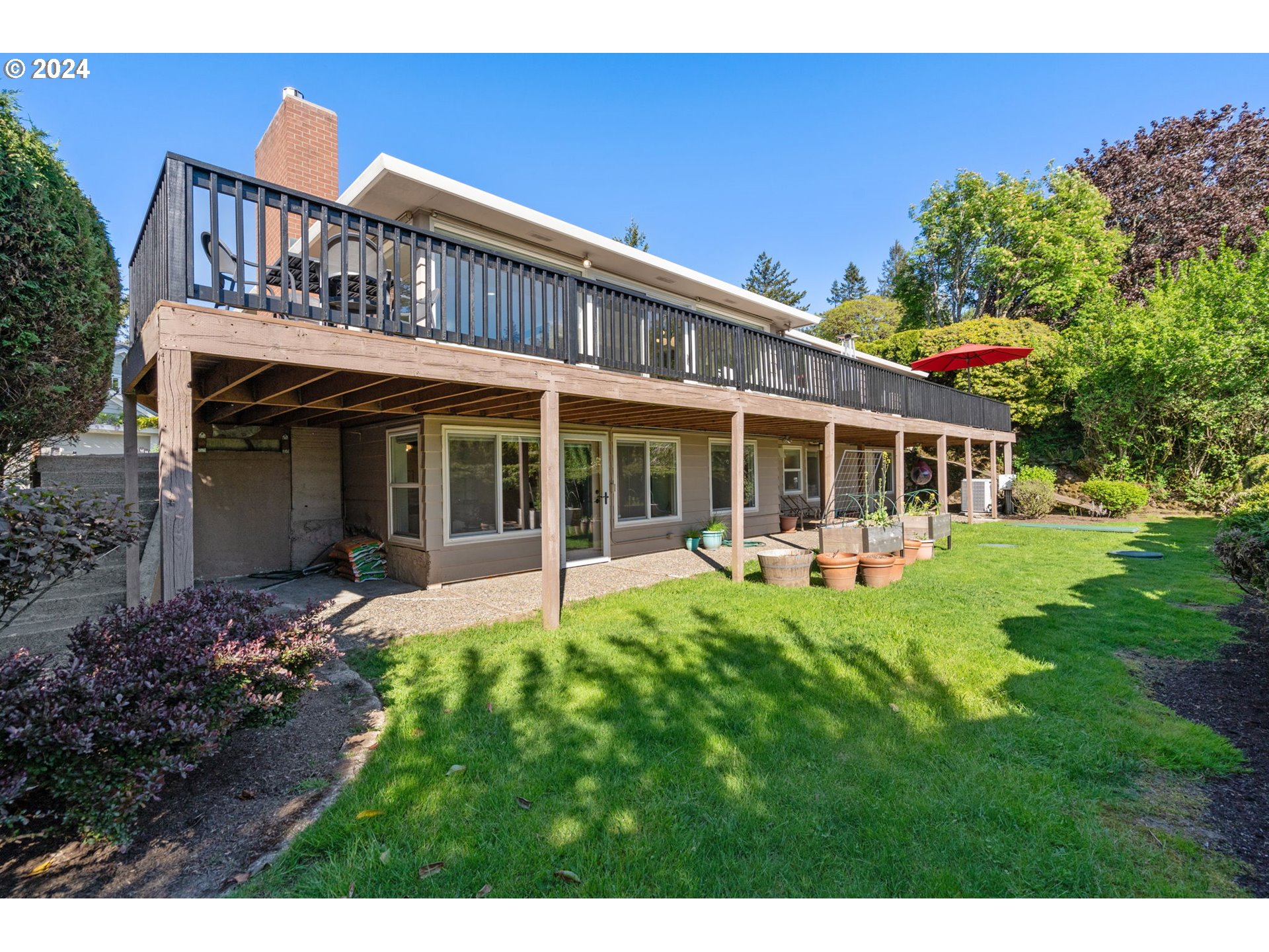 811 Northwest Skyline Crest Road Portland, OR 97229 - Photo 42 of 45 a view of a house with a yard and sitting area