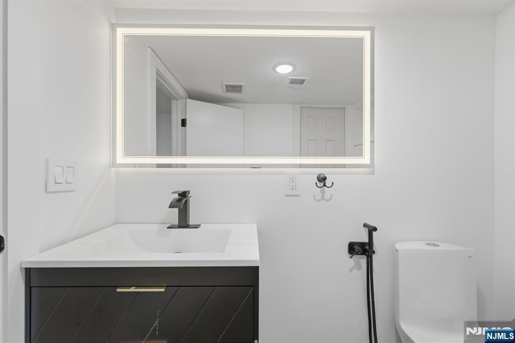 275 Longview Road Union, NJ 07083 - Photo 37 of 43 a bathroom with a sink and a mirror