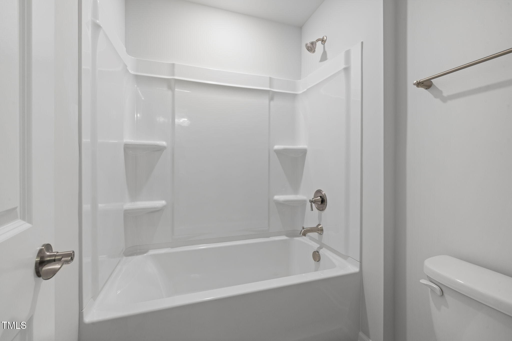 1385 Rowboat Road Apex, NC 27502 - Photo 11 of 22 a bathroom with a bathtub and a shower