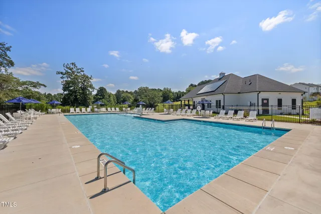 a view of swimming pool and outdoor seating