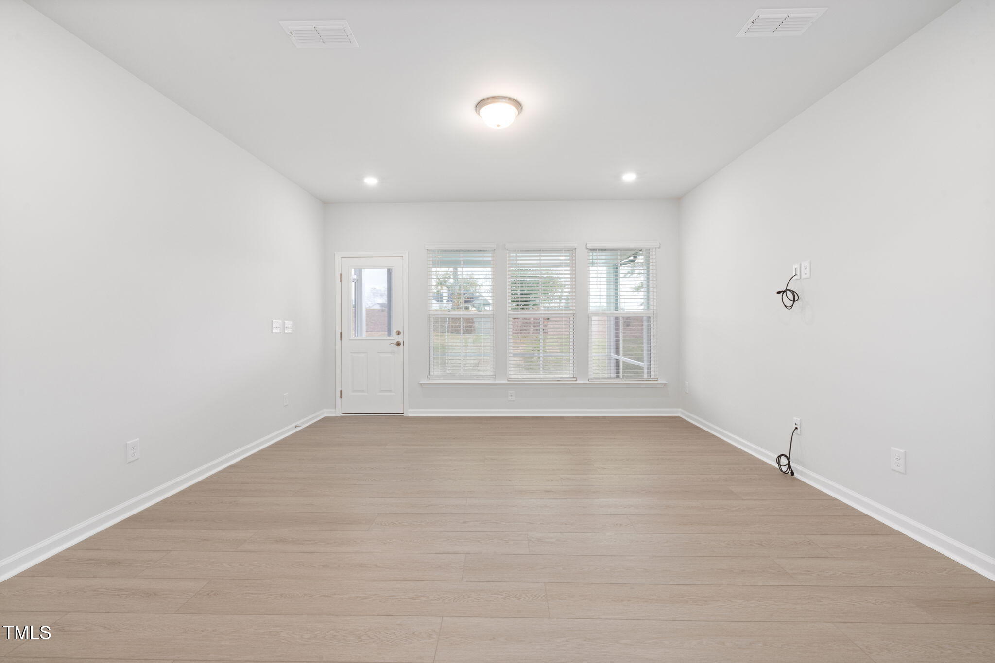 1385 Rowboat Road Apex, NC 27502 - Photo 7 of 22 a view of an empty room with a window