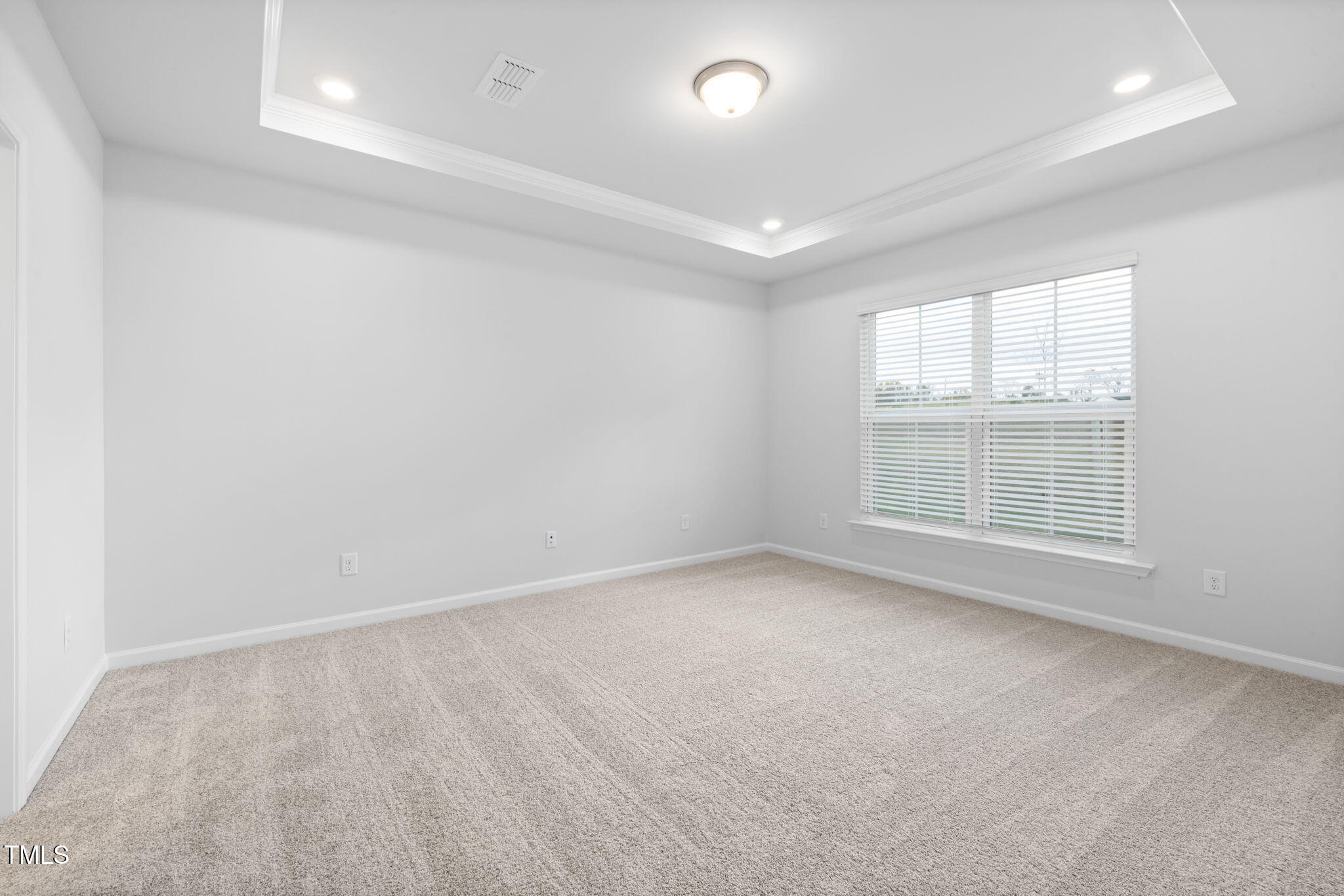 1385 Rowboat Road Apex, NC 27502 - Photo 9 of 22 an empty room with a empty space and windows