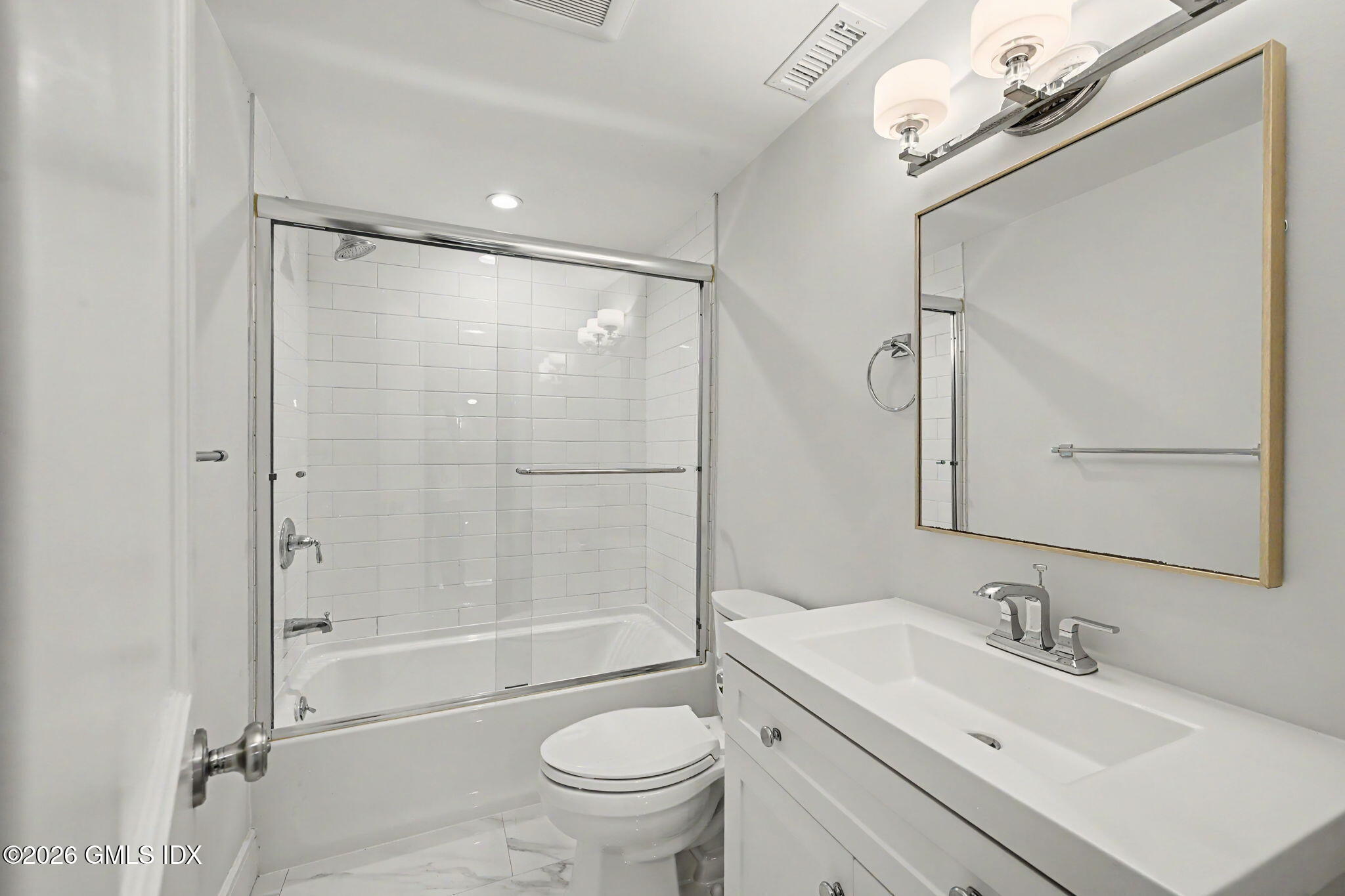 124 Shore Road Old Greenwich, CT 06870 - Photo 14 of 28 a bathroom with a sink mirror vanity and toilet