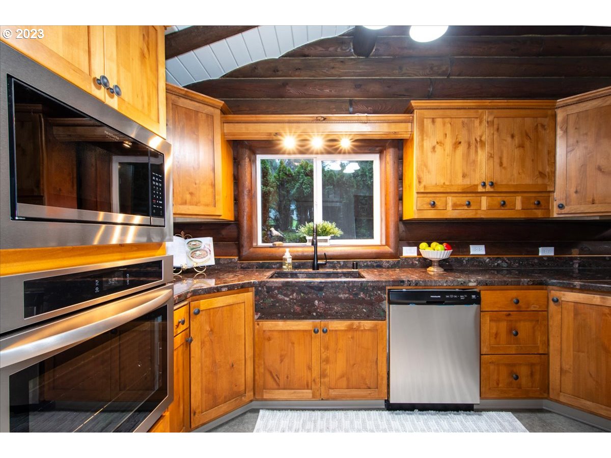 101 Shelley Road Longview, WA 98632 - Photo 14 of 33 a kitchen with stainless steel appliances granite countertop a sink and a stove