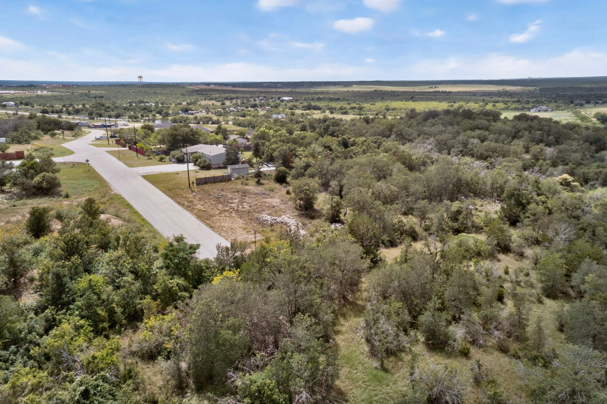 693 Santa Teresa Road Kyle, TX 78640 - Photo 10 of 20 A rural landscape with a clear sky showcases undeveloped land ready for opportunity.
