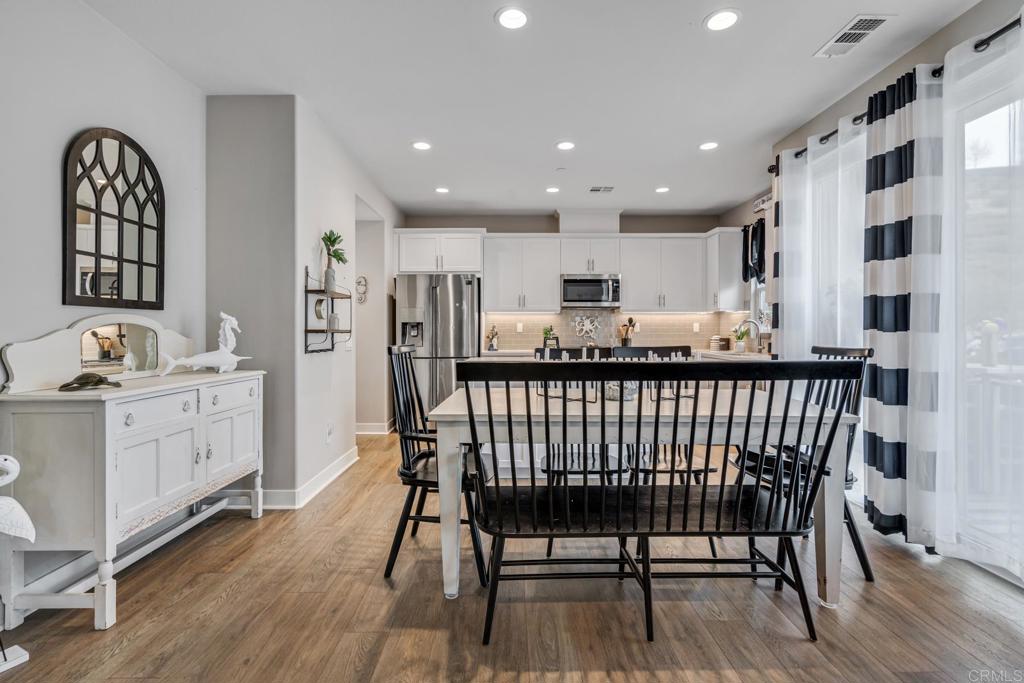 4315 Star Path Way, Unit 4 Oceanside, CA 92056 - Photo 6 of 40 a dining room with furniture and wooden floor