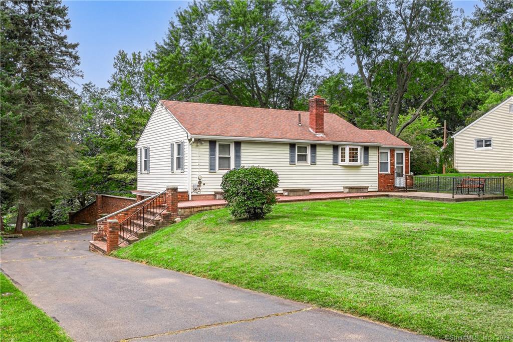 22 Woodland Road Portland, CT 06480 - Photo 1 of 1 a view of a house with a yard and large tree