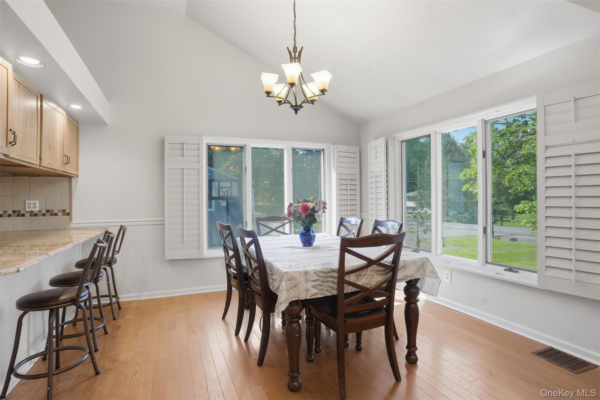 147 County Rte 1 Warwick, NY 10990 - Photo 15 of 45 a dining room with furniture a large window and a chandelier