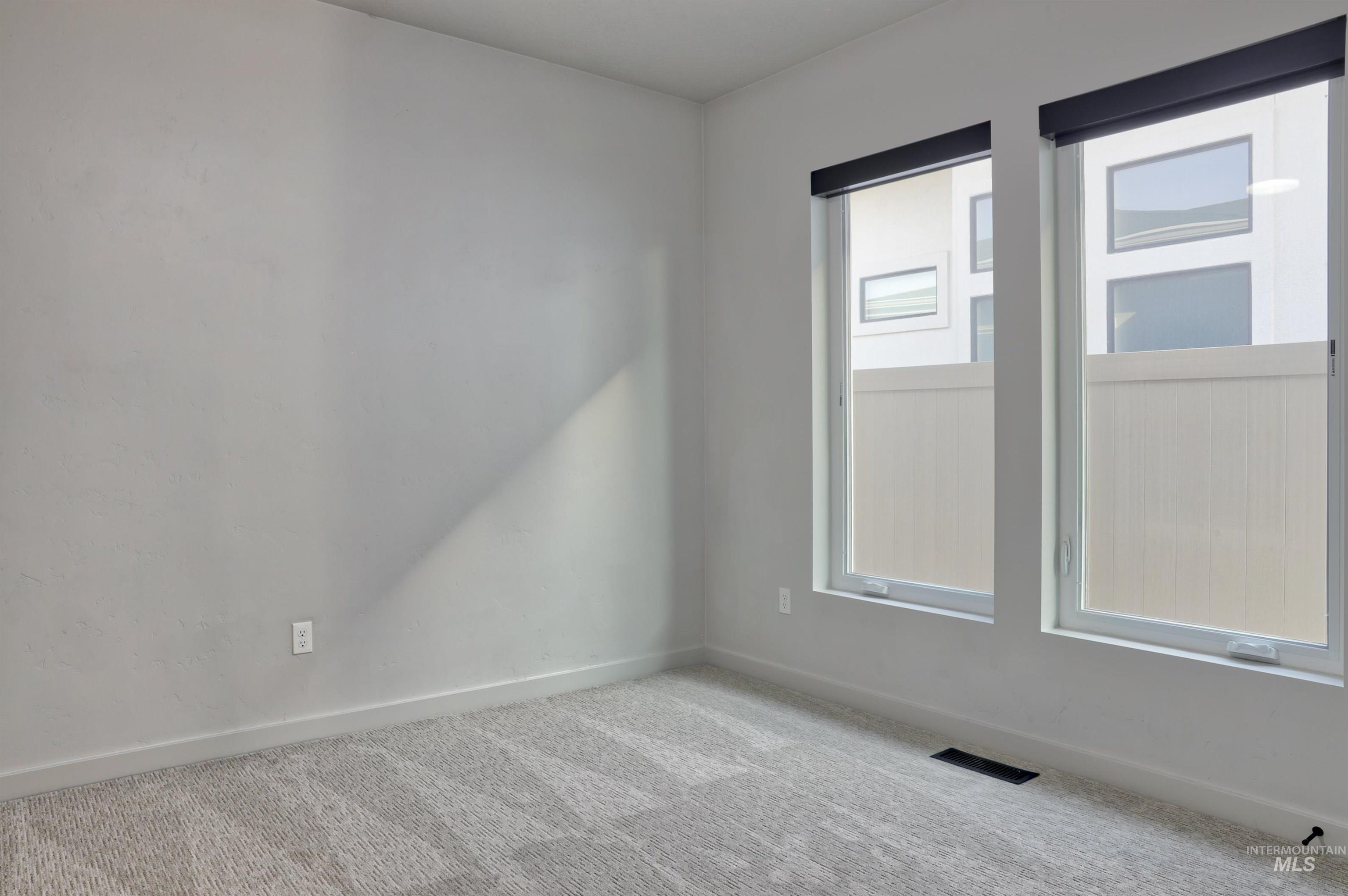 4148 East Copper Point Drive Meridian, ID 83642 - Photo 16 of 26 Spare room featuring baseboards and carpet floors