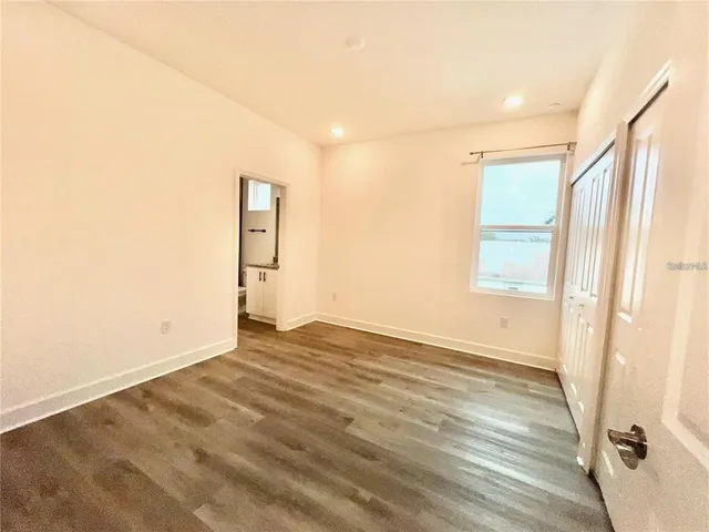 a view of an empty room and window