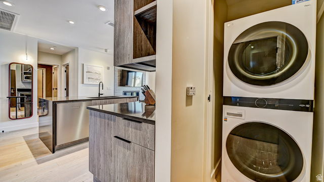 2417 West High Road, Unit 2515 Park City, UT 84098 - Photo 15 of 67 Laundry area featuring stacked washer and dryer, light wood finished floors, and recessed lighting