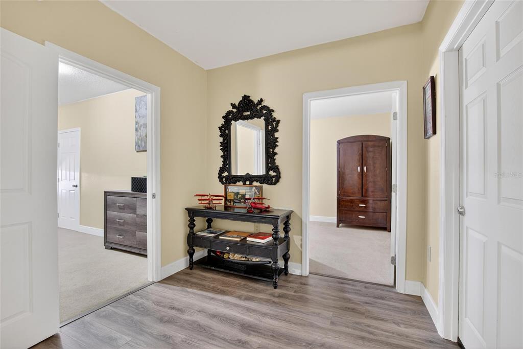 4639 Birdsong Boulevard, Unit 2 Lutz, FL 33559 - Photo 14 of 25 a view of room with furniture and wooden floor